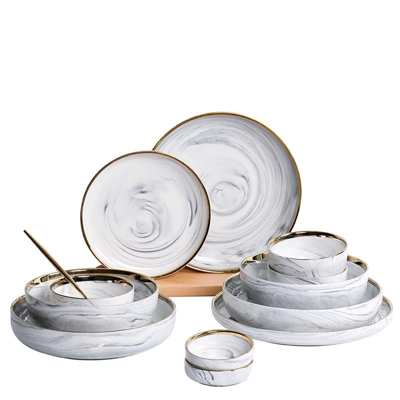 Gold-rimmed porcelain bowl and plate set